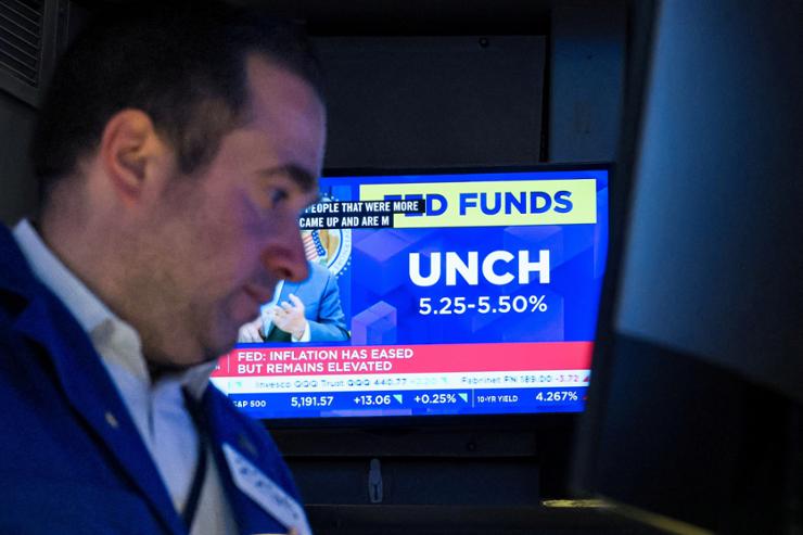 Wall Street rallies to records as Federal Reserve still sees rate cuts ...