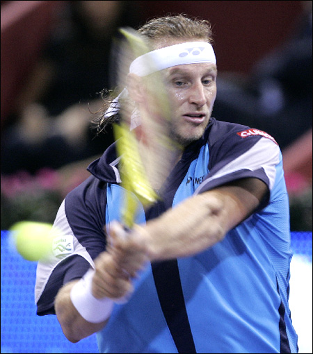 Nabladian Racket David Nalbandian of Argentina returns the ball to Roger... - The Korea ...