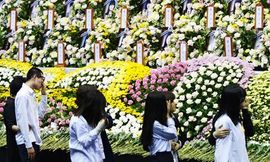 70 surviving students visit friends' altar