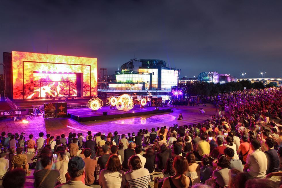 Hangang Summer Festival fire dancing and fireworks performance at Banpo Hangang Park in Seoul at night with pyrotechnic display over the river