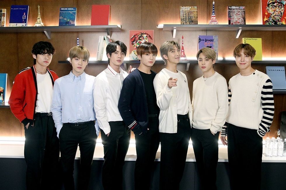 BTS members pose for group photo at CONNECT BTS global art project announcement January 14 2020