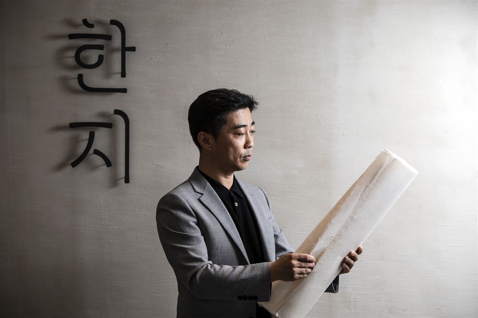 Kim Chun-ho a fifth-generation Korean hanji maker poses at the Hanji Culture and Industry Center in Seoul showing the master craftspeople preserving Korea's traditional mulberry paper