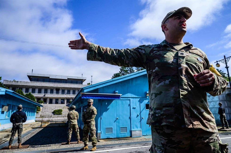 United Nations Command soldier and South Korean soldier on guard at the Joint Security Area Panmunjom DMZ