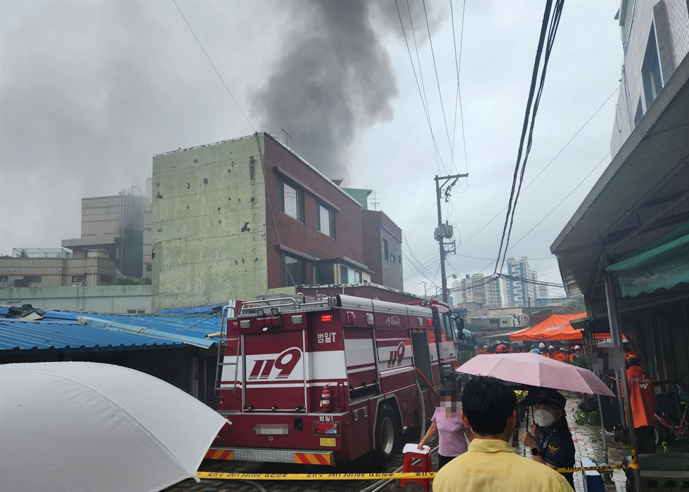                                                                                                  An explosion at a public bathhouse in the southeastern city of Busan injured some 10 people, including firefighters and local public officials, who were nearby to extinguish a fire that erupted earlier, Sept. 1. Yonhap                        