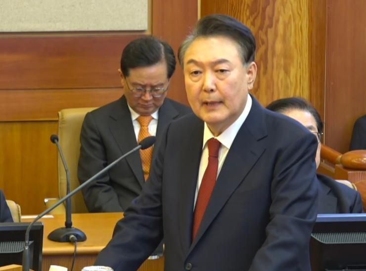 Seoul court revokes president's arrest warrant, securing his release