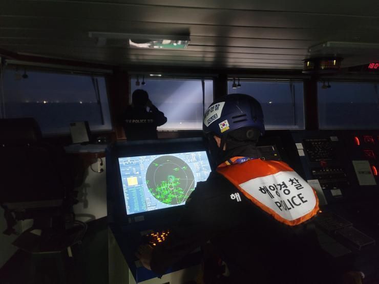 Authorities continue nighttime search for 12 missing from fishing boat