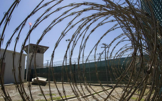 1st military flight lands in Guantanamo Bay with migrants deported from US