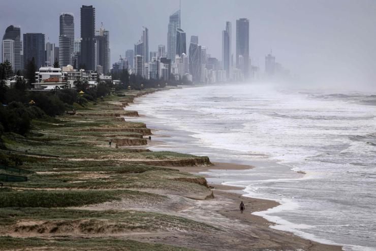 Australian homes lose power and people evacuate as tropical cyclone approaches; 1 man missing