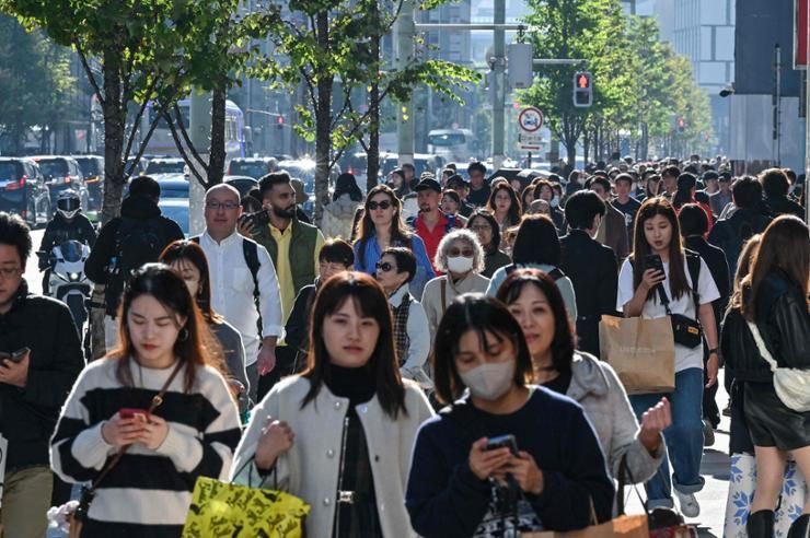 Japan passes $250 bil. economic package meant to lift wages and spur growth